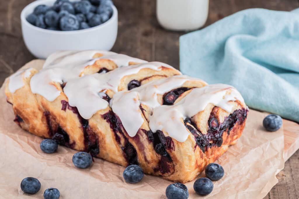 Blueberry pull apart bread on paper.