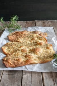 Three MIL tongues on a piece of parchment paper.