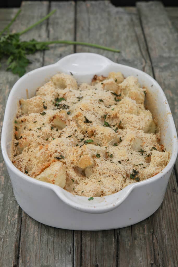 Baked cauliflower in a white pan.