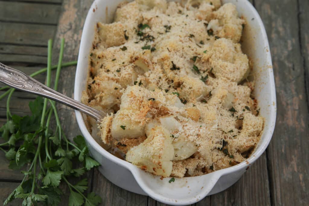 Baked cauliflower in a white pan.