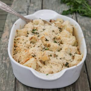Baked cauliflower in a white pan.