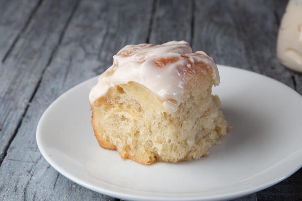 A cinnamon bun on a plate.