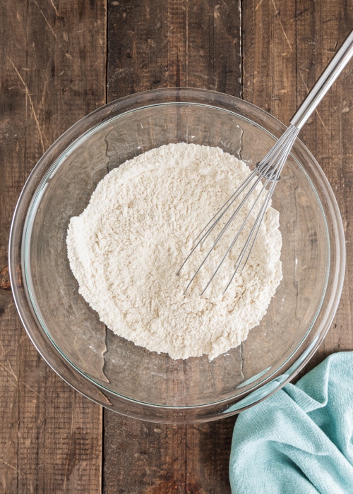 The dry ingredients whisked in a glass bowl.
