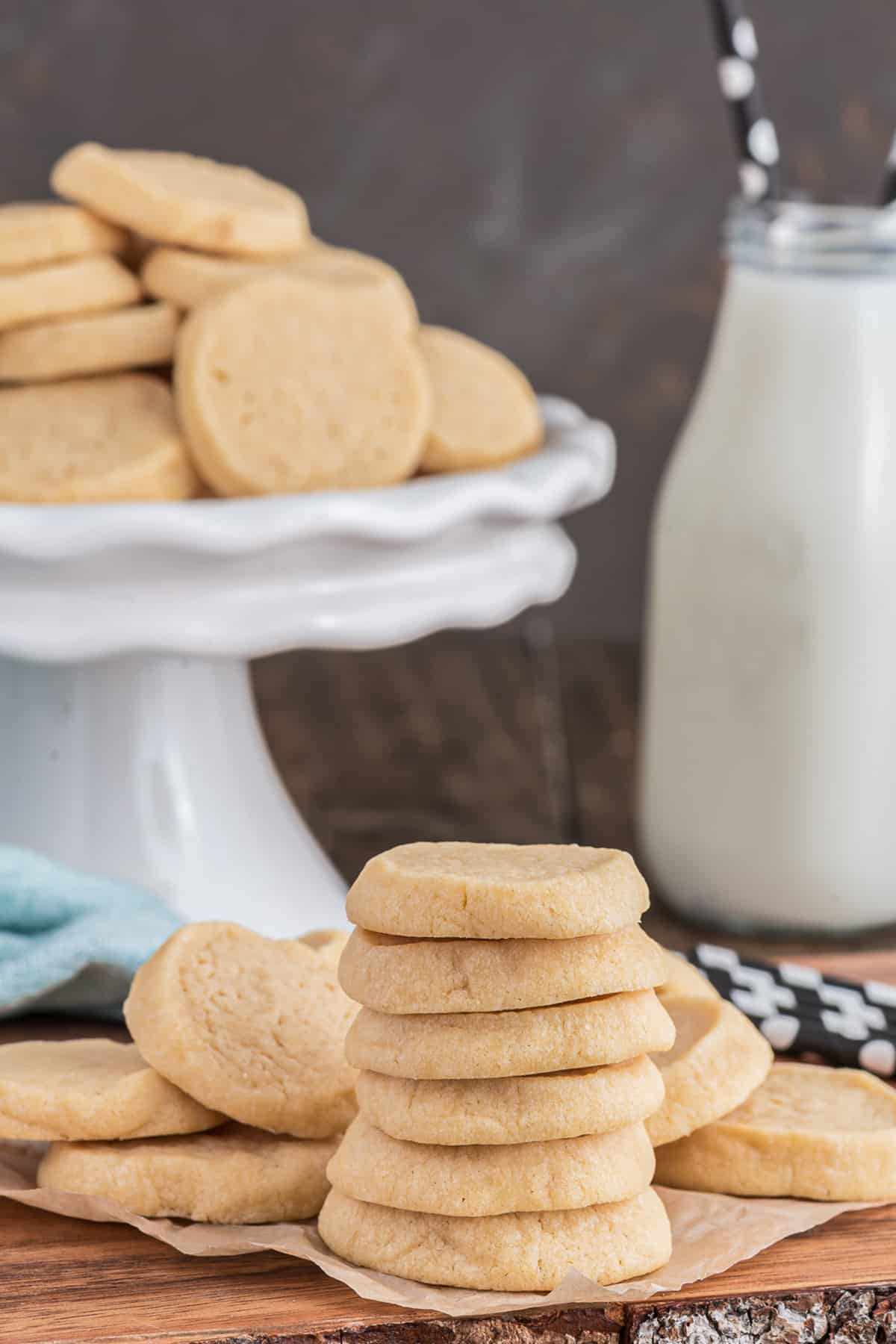 Cookies on a plate stand and six stacked.