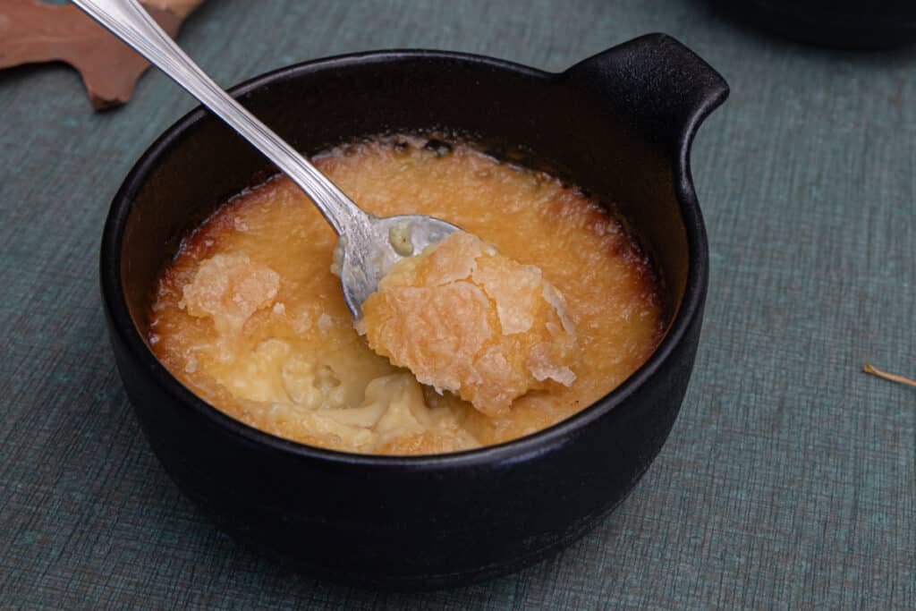 A spoonful of mixture in the ramekin.