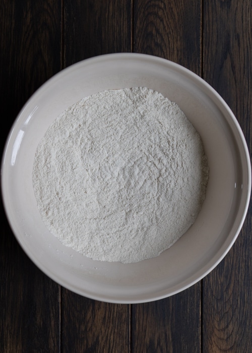 The dry ingredients in a white bowl.