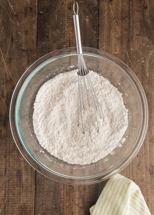 The dry ingredients whisked in a glass bowl.