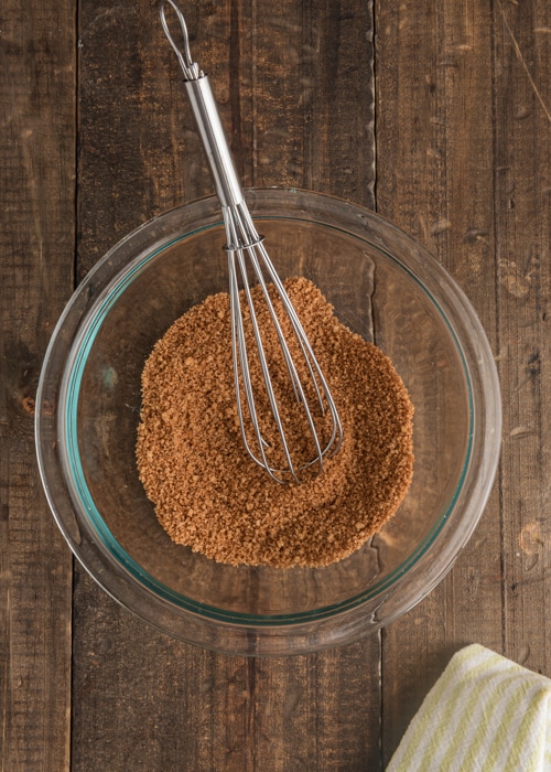 Mixing the brown sugar topping in a glass bowl.