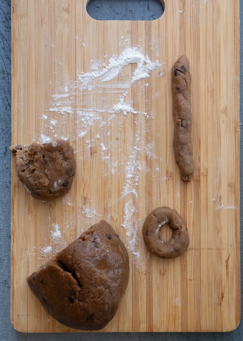 Cutting the dough and rolling into a rope.