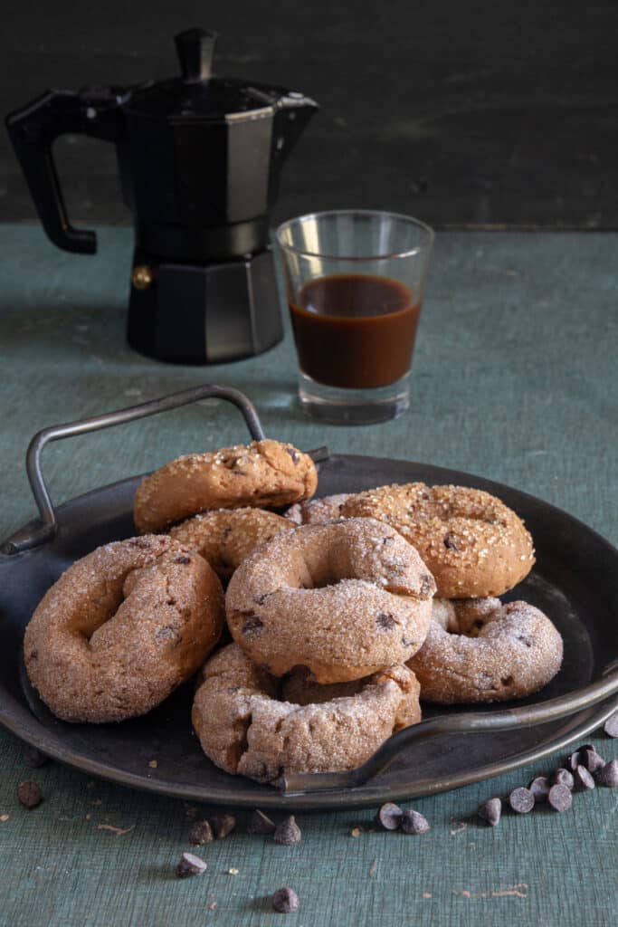 Espresso cookies on a black plate.