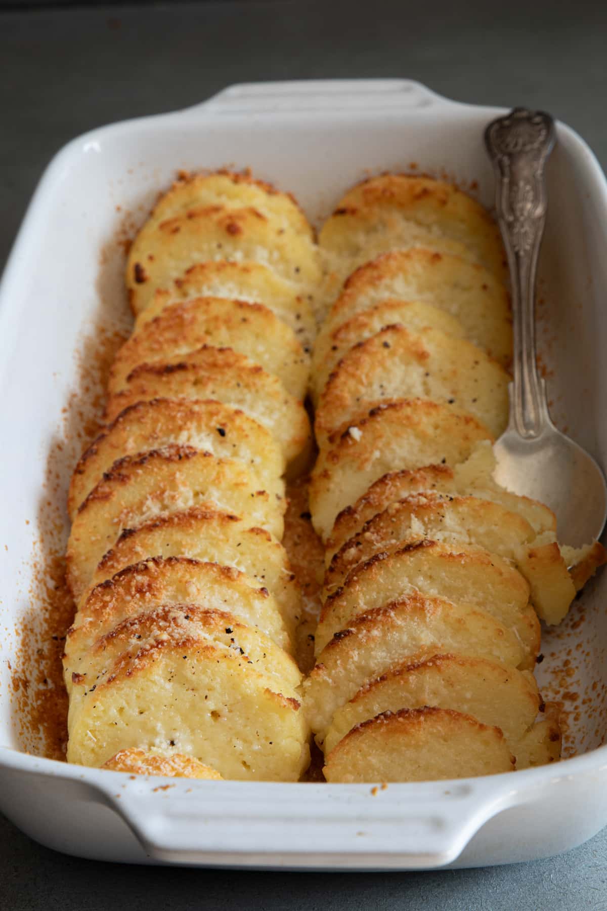 Roman Gnocchi in a white pan.