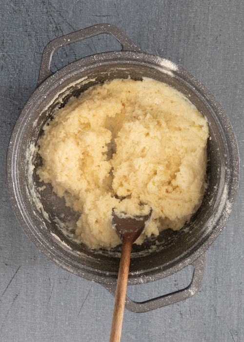 Mixing the dough in the pot.