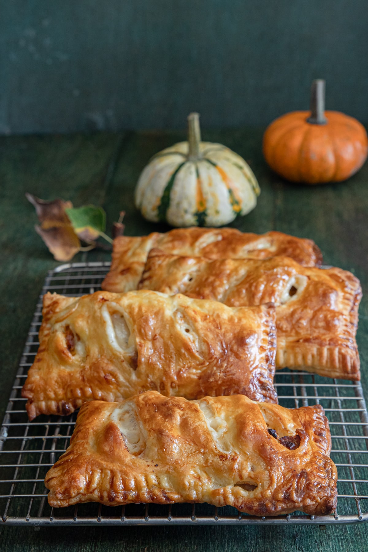 Hand pies on a wire rack.