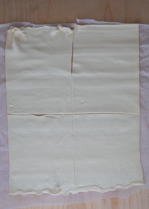 Cutting the pastry into four squares.