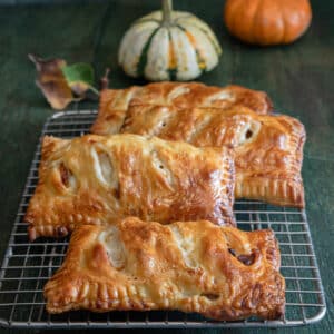 Hand pies on a wire rack.