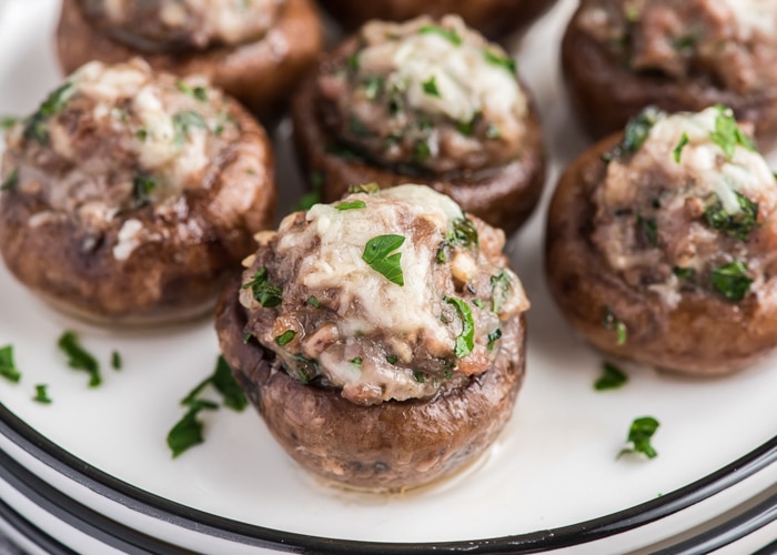 Stuffed mushrooms on a white plate.