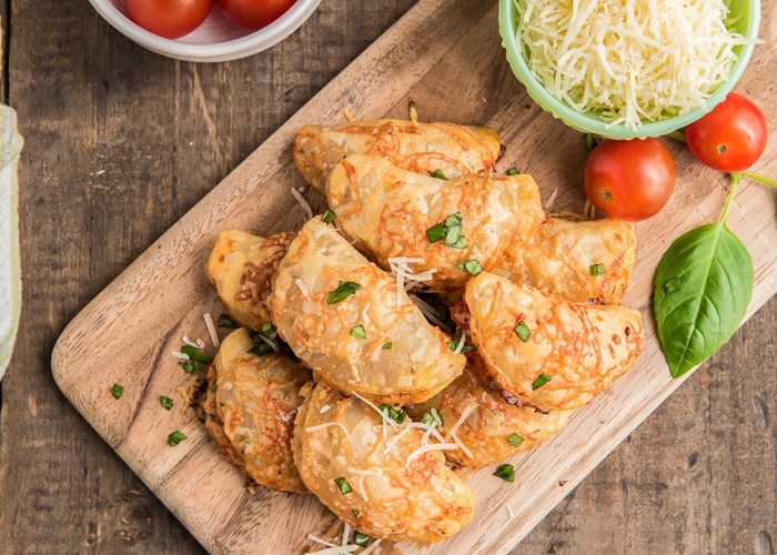 Tomato appetizers on a wooden board.