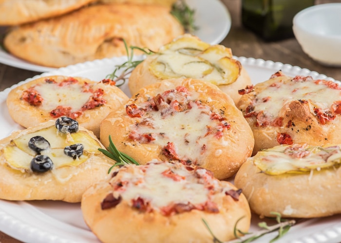 Mini pizzas on a plate.