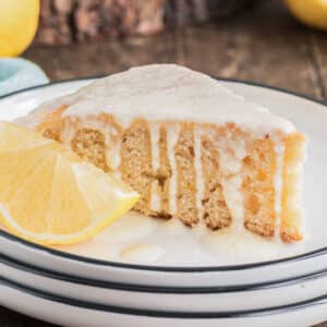 A slice of honey lemon cake on a white plate.