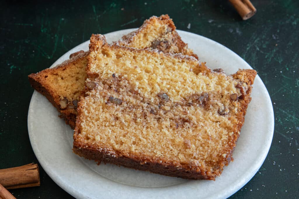 Two slices of bread on a white plate.