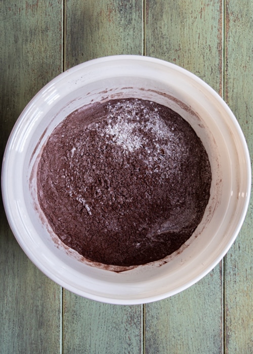 The dry ingredients whisked in a white bowl.