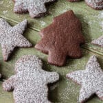 Chocolate sugar cookies on a board.