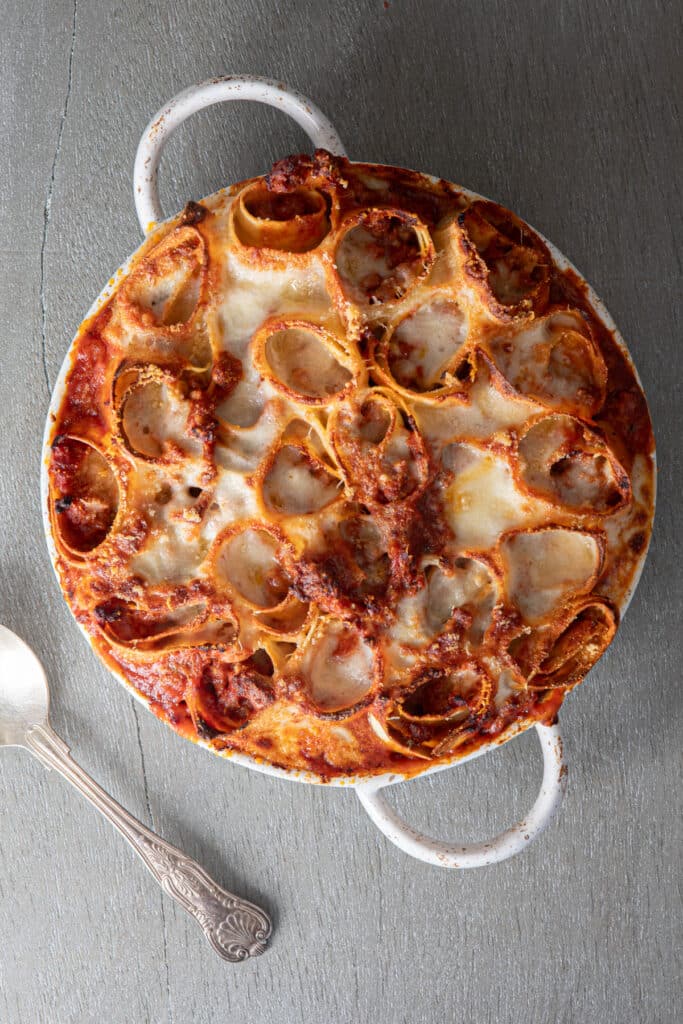 Lasagna rolls in a white pan.