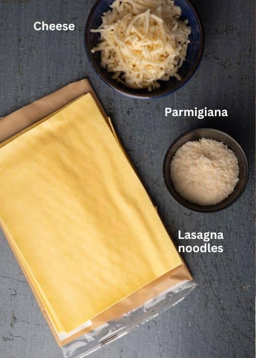 Lasagna noodles and cheese ingredients.