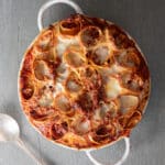 Lasagna rolls in a white pan.