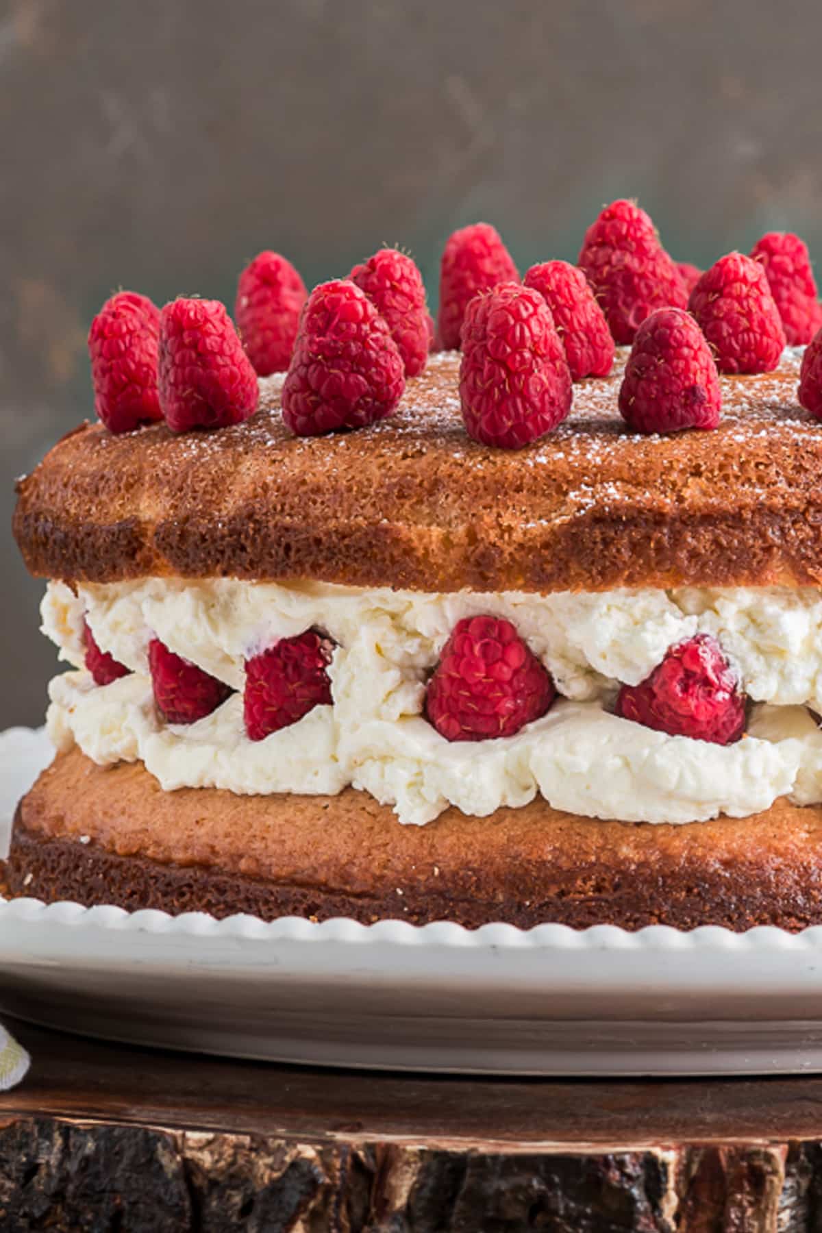 Layered cheesecake on a white plate.