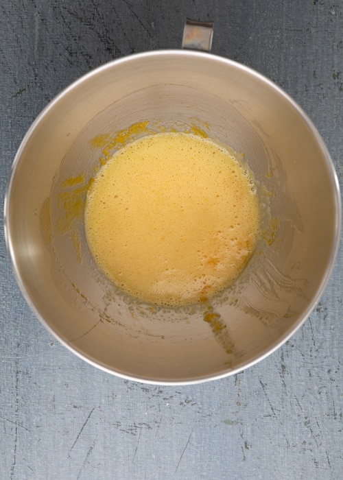 The egg and sugar beaten in the mixing bowl.