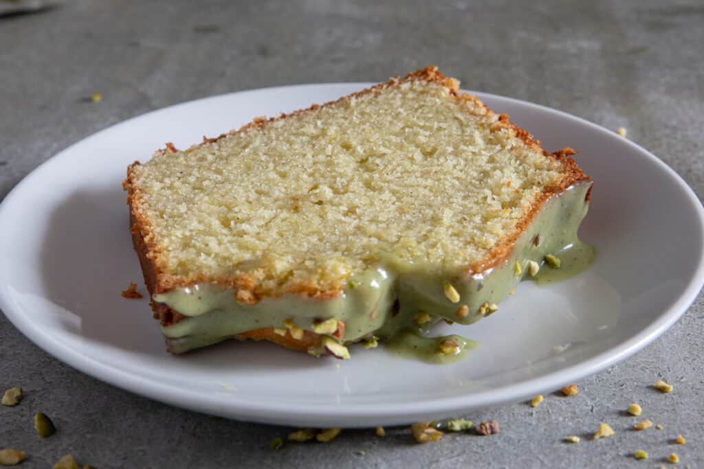 A slice of sweet bread on a white plate.