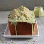 Pistachio bread frosted on a white plate.