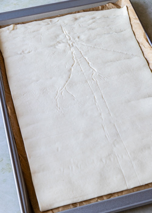The puff pastry on a baking sheet.