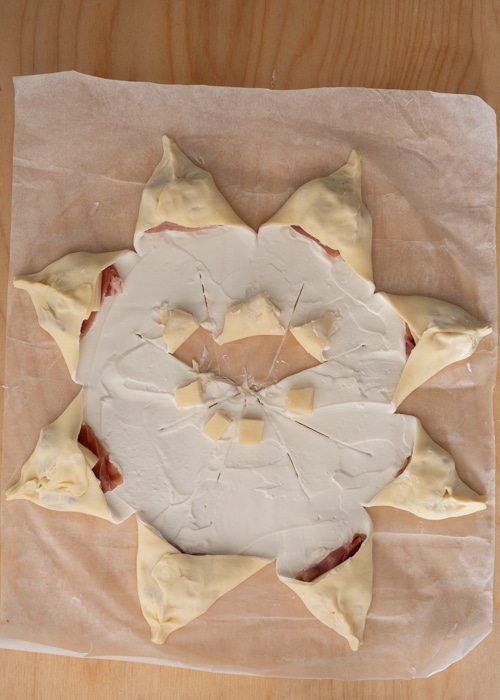 Adding the cube of cheese to the second triangles.