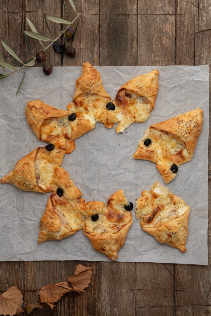 The pastry star with two slices cut.