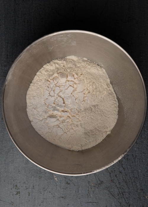 The sifted dry ingredients in a silver bowl.