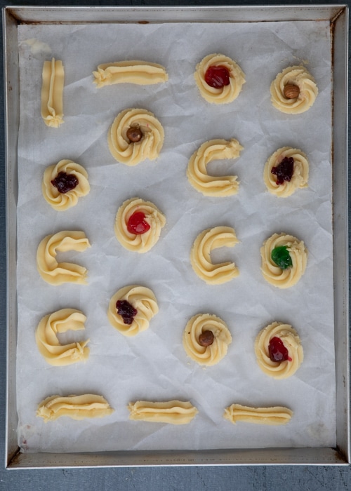 The cookies formed and decorated before baking.