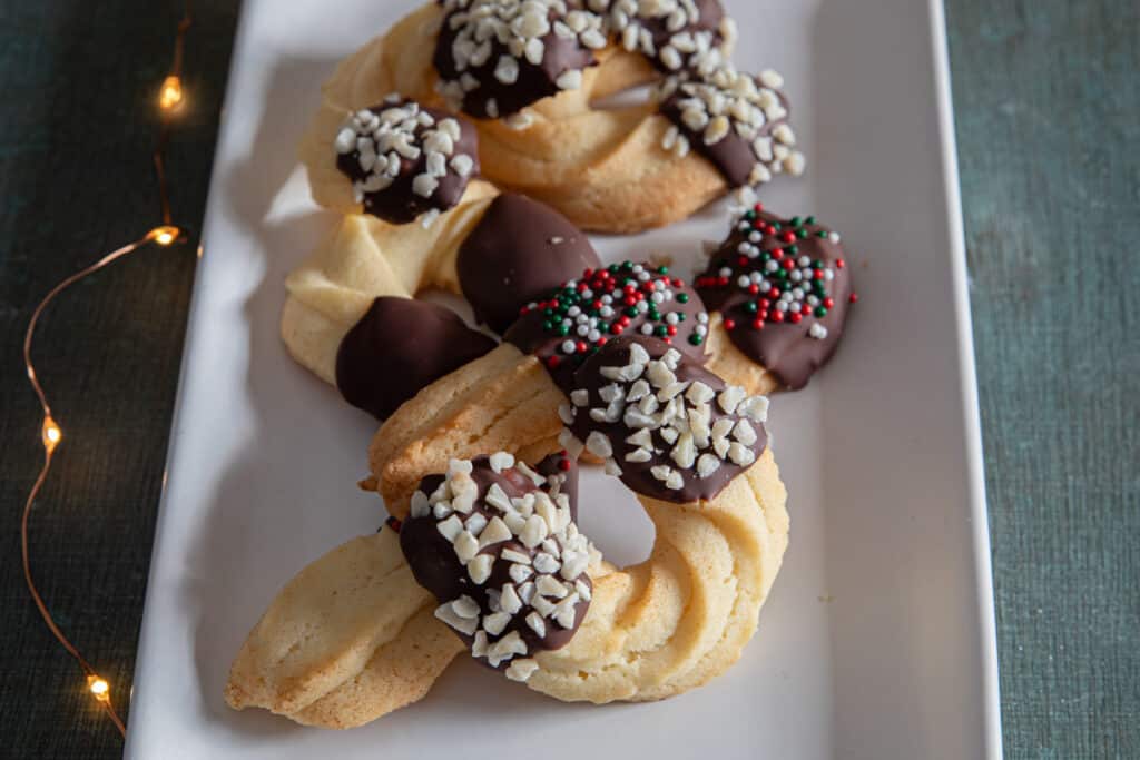 Decorated cookies on a white plate.