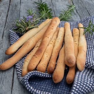 Grissini on a blue napkin.