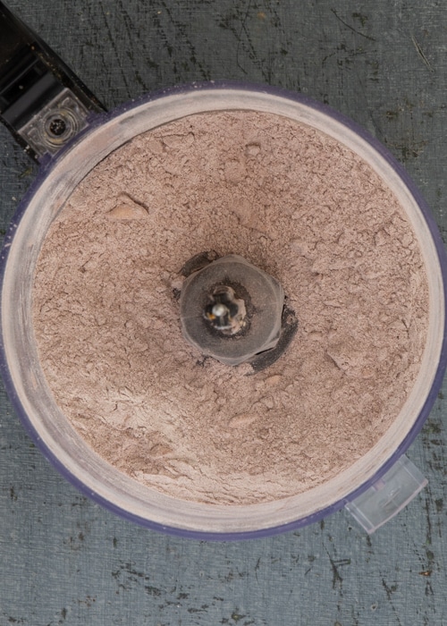 The butter added and pulsed to form crumbs.