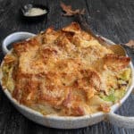 Cabbage soup in the white dish.