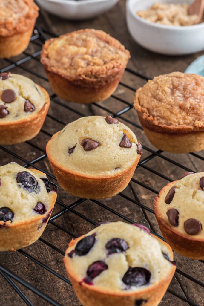 Muffins on a black wire rack.