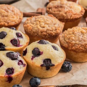 Muffins on a piece of brown paper.