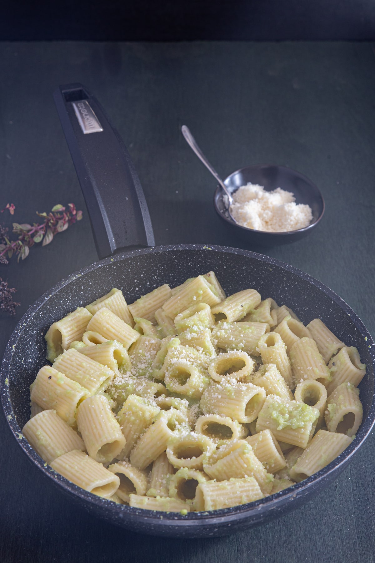 Broccoli pasta in a skillet.