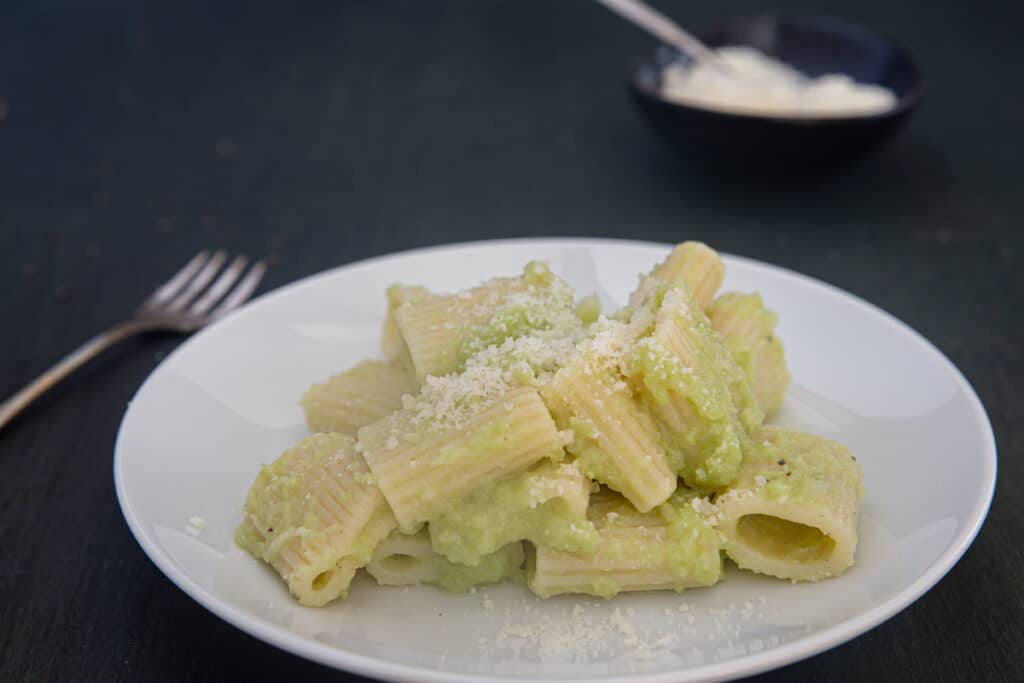 Broccoli pasta in a white plate.