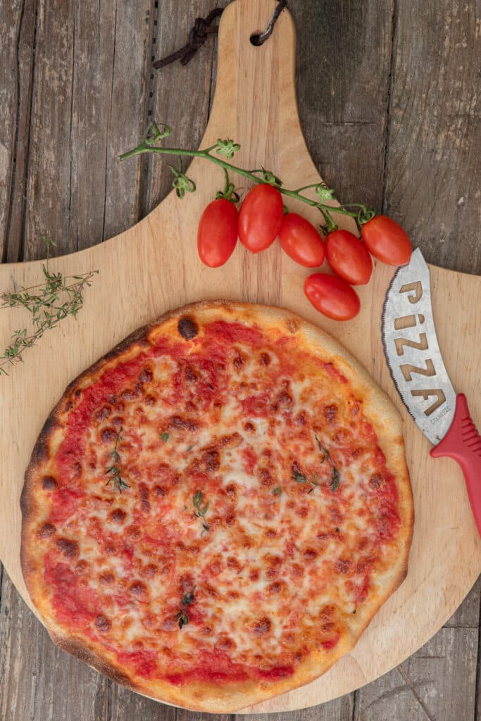 The pizza scrocchiarella on wooden board.