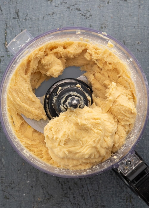 Adding the remaining ingredients and forming a dough.