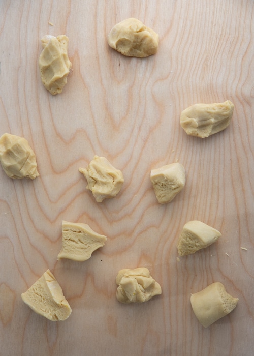 Dividing the dough into small pieces.