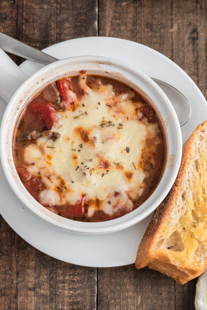 Pizza soup in a white bowl.